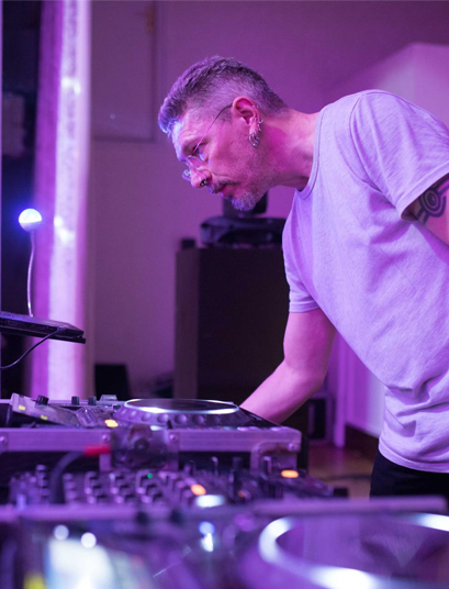 Simon DJing at a party